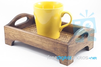 Yellow Mug On Wooden Tray Isolated On White Background Stock Photo