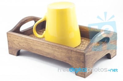 Yellow Mug On Wooden Tray Isolated On White Background Stock Photo