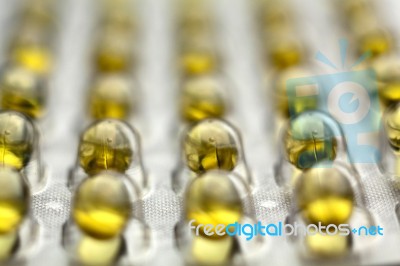 Yellow Oil Pills Stock Photo