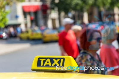 Yellow Taxi Sign On Cab Vehicle Roof Stock Photo