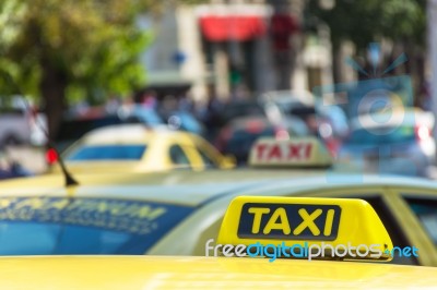 Yellow Taxi Sign On Cab Vehicle Roof Stock Photo