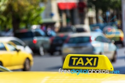 Yellow Taxi Sign On Cab Vehicle Roof Stock Photo