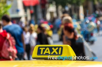 Yellow Taxi Sign On Cab Vehicle Roof Stock Photo