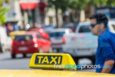 Yellow Taxi Sign On Cab Vehicle Roof Stock Photo