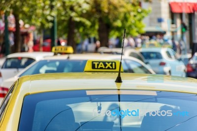 Yellow Taxi Sign On Cab Vehicle Roof Stock Photo