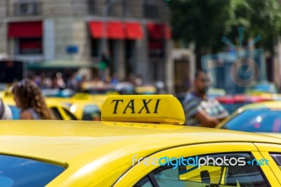 Yellow Taxi Sign On Cab Vehicle Roof Stock Photo