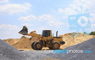 Yellow Tractor On Construction Site Stock Photo