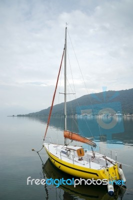 Yellow Yacht Moored On Lake Iseo At Sarnico Stock Photo