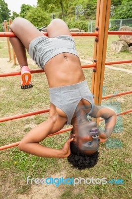 Young African Woman Doing Sit-ups Stock Photo