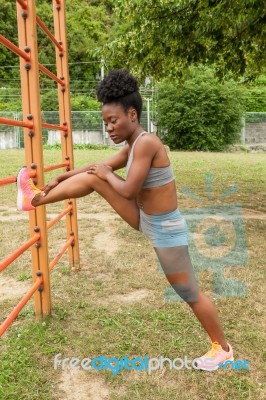 Young African Woman Doing Stretching Stock Photo