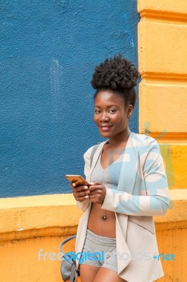 Young African Woman With A Smartphone Stock Photo