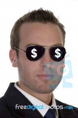 Young American Businessman With Dollar Signs On His Sunglasses Stock Photo