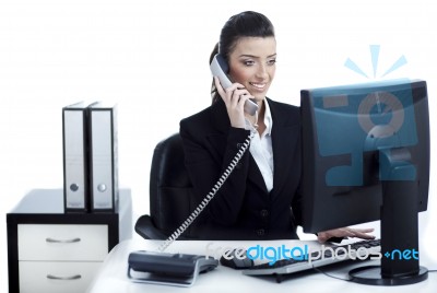 Young And Pretty Business Woman Talking Over Phone Stock Photo