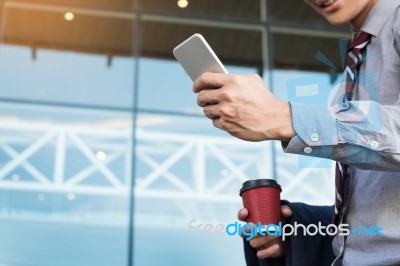 Young And Successful Businessman Is Reading A Message On His Sma… Stock Photo