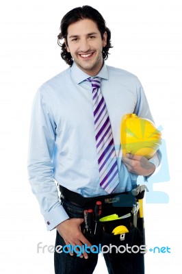 Young Architect Holding Hard Hat Stock Photo