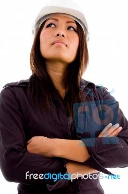 Young Architect Wearing Helmet And Posing With Crossed Arms Stock Photo