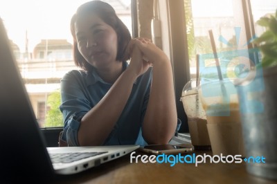 Young Asian Woman Working In Coffee Shop Stock Photo