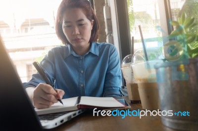 Young Asian Woman Working In Coffee Shop Stock Photo