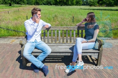 Young Attractive Caucasian Couple Calling Mobile Stock Photo