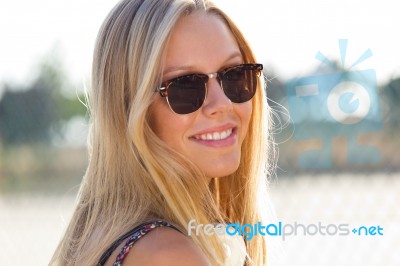 Young Attractive Woman With Sunglasses On A Summer Day Stock Photo