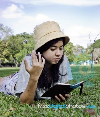 Young Beautiful Asian Woman With Book Stock Photo