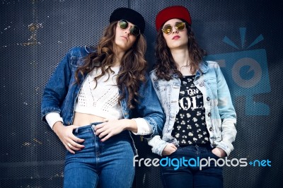 Young Beautiful Girls With Denim Suit In A Urban Background Stock Photo