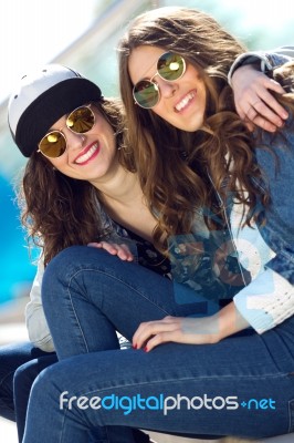 Young Beautiful Girls With Denim Suit In A Urban Background Stock Photo