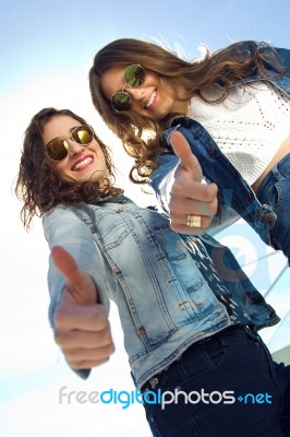 Young Beautiful Girls With Denim Suit In A Urban Background Stock Photo