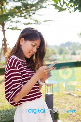 Young Beautiful Woman Connecting By Chat And Reading Message In Stock Photo