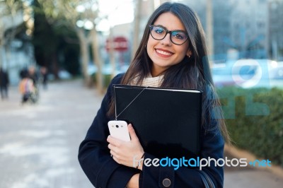 Young Beautiful Woman Looking At Camera In The Street Stock Photo