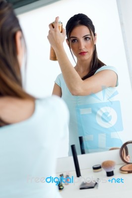 Young Beautiful Woman Making Hairstyle Near Mirror Stock Photo