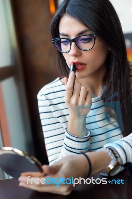 Young Beautiful Woman Making Up Her Face Stock Photo