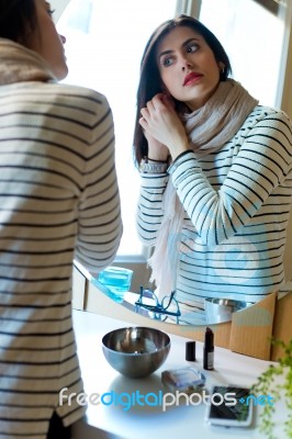 Young Beautiful Woman Making Up Her Face Stock Photo