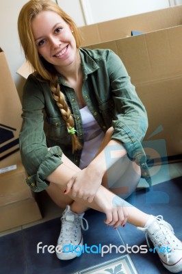 Young Beautiful Woman Moving In A New Home Stock Photo