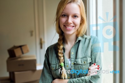 Young Beautiful Woman Moving In A New Home Stock Photo