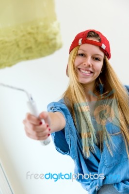 Young Beautiful Woman Painting Hew New Home Stock Photo