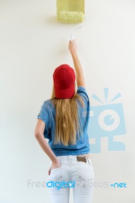 Young Beautiful Woman Painting Hew New Home Stock Photo