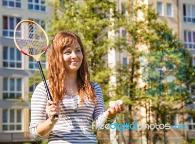 Young Beautiful Woman Playing Badminton Stock Photo