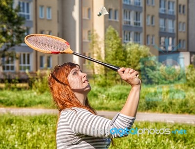 Young Beautiful Woman Playing Badminton Stock Photo