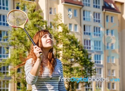 Young Beautiful Woman Playing Badminton Stock Photo