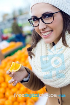 Young Beautiful Woman Shopping Fruit In A Market Stock Photo