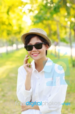 Young Beautiful Woman Wearing Sun Glasses And Fashion Straw Hat Stock Photo