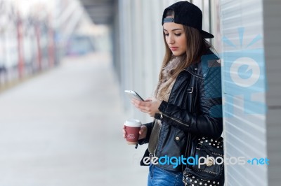 Young Beautiful Woman With Mobile Phone And Coffee Stock Photo