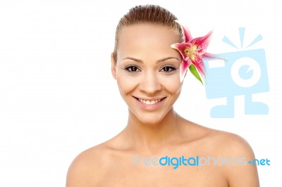 Young Beautiful Woman With Pink Flower Stock Photo