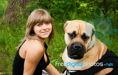 Young Blond Woman With Her Dog Stock Photo