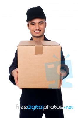 Young Boy Delivering Parcel Safely Stock Photo