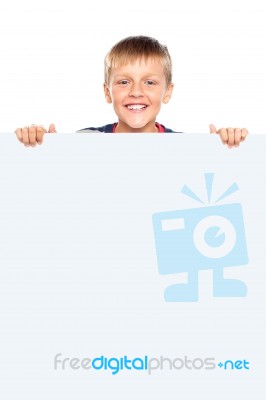 Young Boy Holding Blank Board Stock Photo