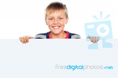 Young Boy Holding Blank Board Stock Photo