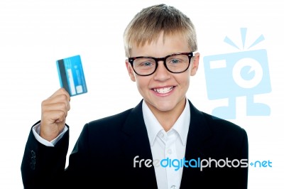 Young Boy Holding Credit Card Stock Photo