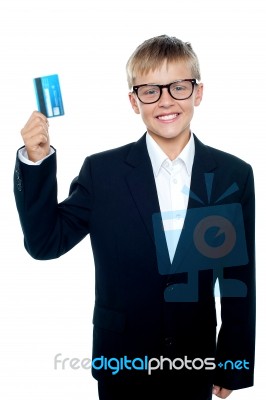 Young Boy Holding Credit Card Stock Photo